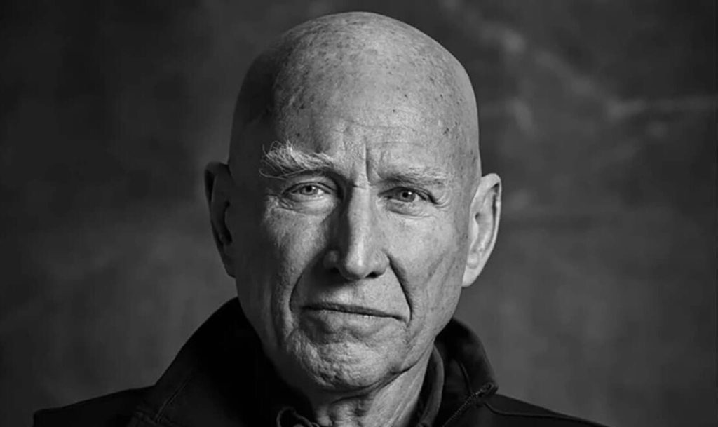 A black and white photo of an older man.